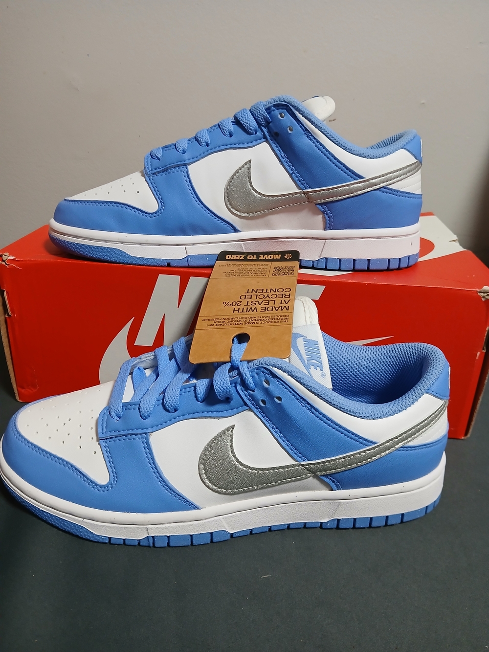 Nike Women’s Low-Top Sneakers in White/Blue with Silver Swoosh